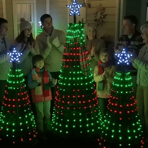 Family watching three Christmas light show trees run a color sequence