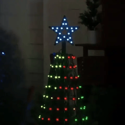 Close up of the illuminated star topper cycling colors