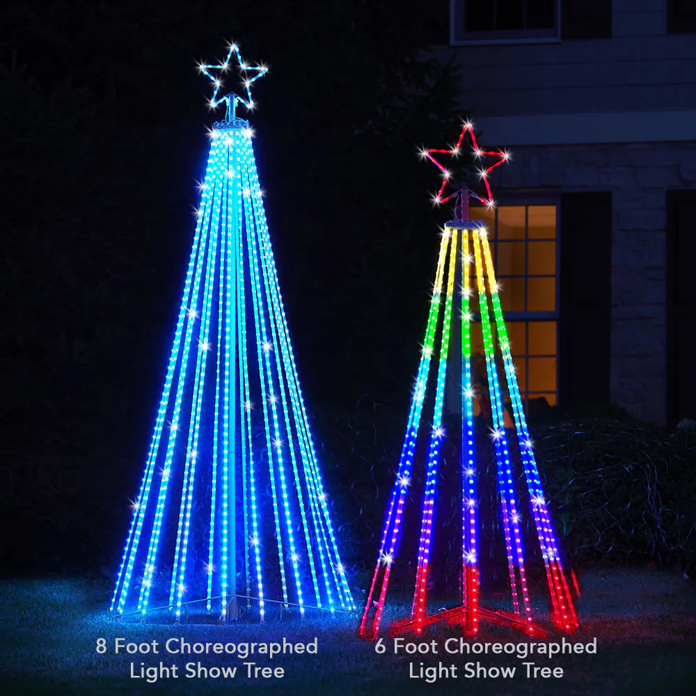8 ft and 6 ft Choreographed Light Show Tree lit in a front yard at night